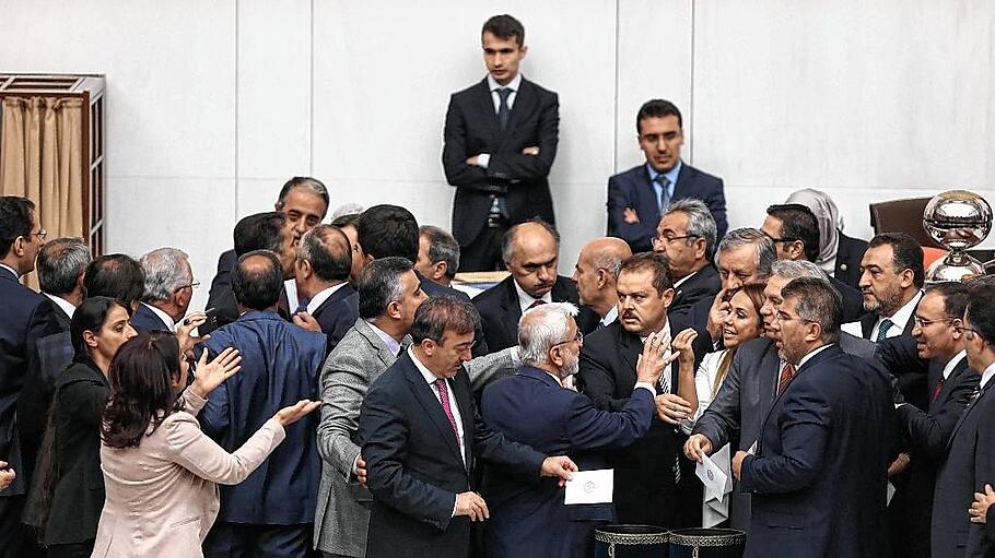 Turkish lawmakers vote on a bill lifting immunity