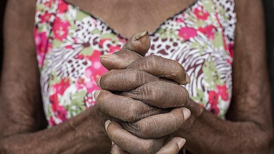 Senior Afro-Brazilian woman with joined hands Brazil, State of Minas Gerais ,editorial use only PUBLICATIONxINxGERxSUIxA