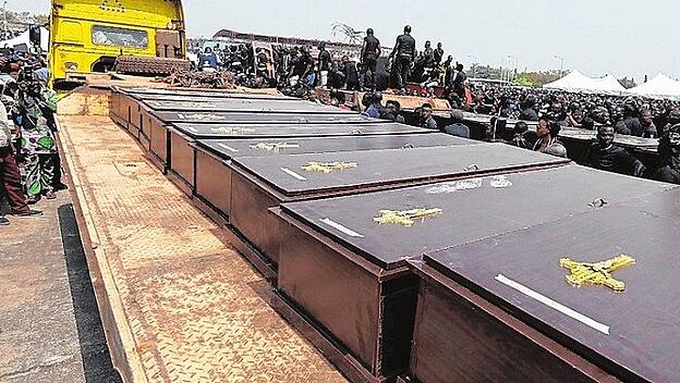 A truck carries the coffins of people killed by the Fulani herdsmen at the IBB square in Makurdi