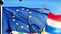 EU flags waving over blue sky. Brussels, Belgium