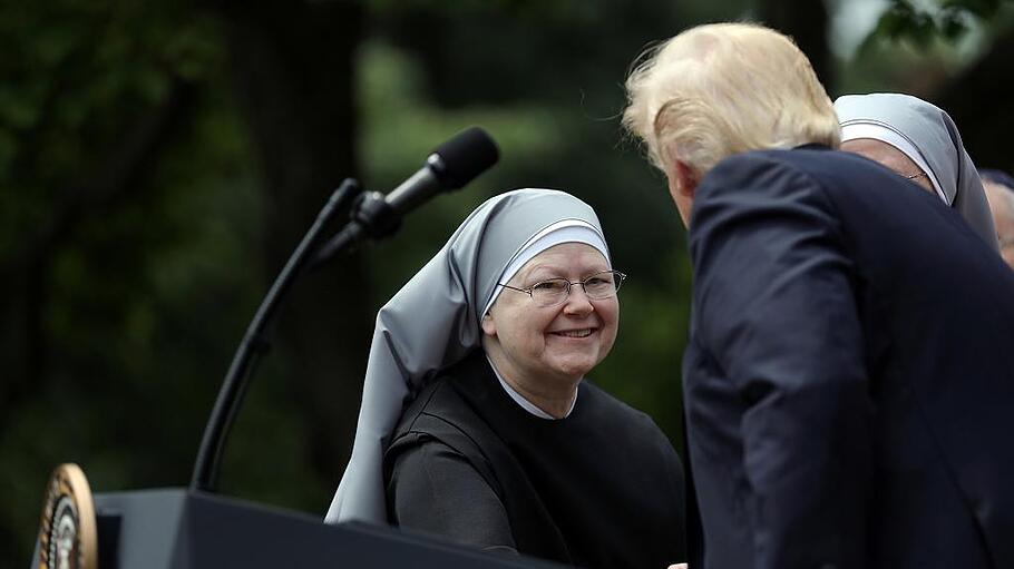 U.S. President Donald Trump shakes hands with a nun of the Little Sisters of The Poor during a National Day of Prayer event at the Rose Garden of the White House in Washington D.C.