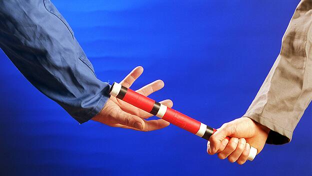 Stabübergabe beim Staffellauf