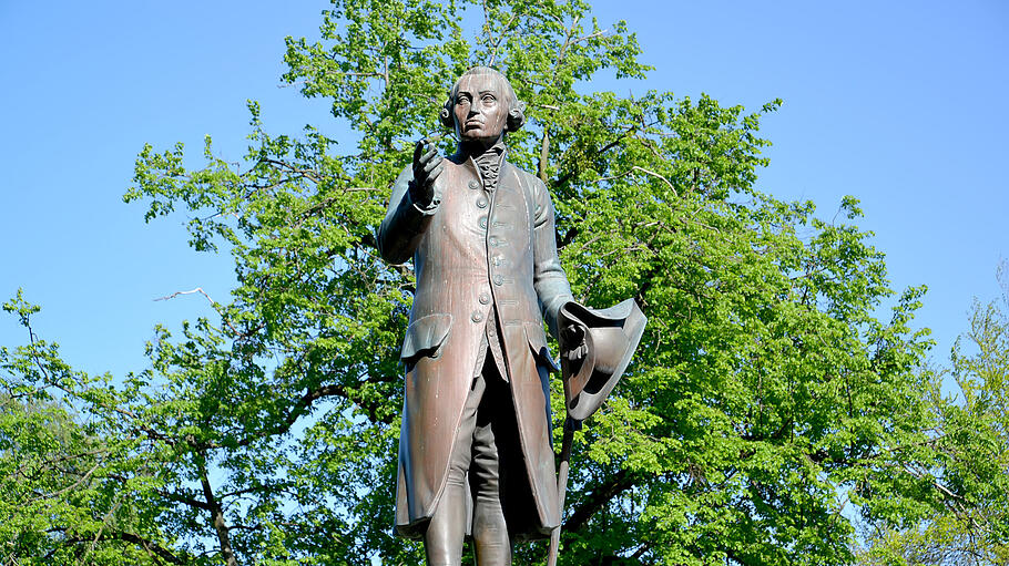 Monument to the philosopher Immanuel Kant against the background of foliage. Kaliningrad