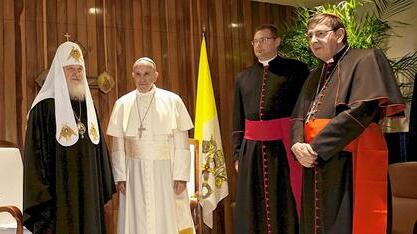 Russian Orthodox Patriarch Kirill and Pope Francis stand with others during a meeting in Havana