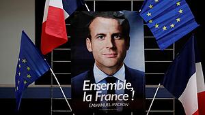 FILE PHOTO: An electoral poster of Emmanuel Macron, head of the political movement En Marche !, or Onwards !, and candidate for the 2017 presidential election, is displayed during a campaign rally in Paris