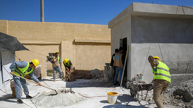 September 25, 2023: Aleppo, Syria. 25 September 2023. Members of Unicef and of a local NGO supervise builders restoring