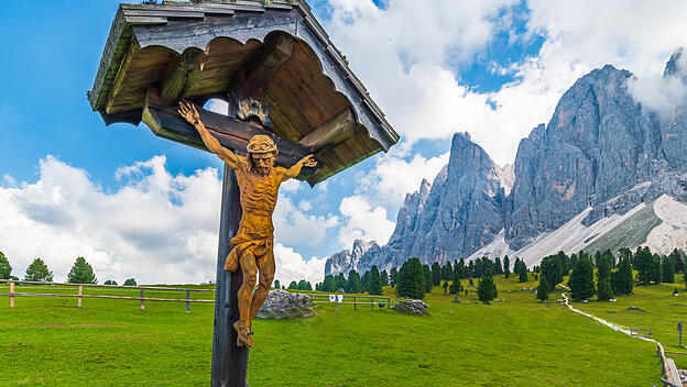 Jesus Crist cross, Summer landscape in Val di Funes valley, Santa Maddalena Village, Trentino Alto A