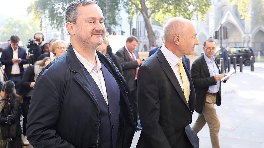 Gareth Lee, and Michael Wardlow of the Equalities Commission, leave after speaking outside the Supreme Court in London