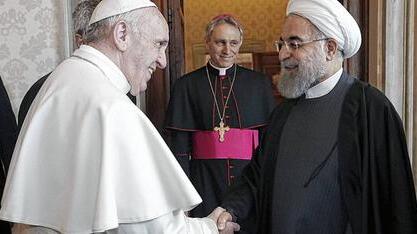 Iran's President Rouhani is welcomed by Pope Francis at the Vatican