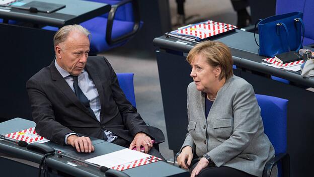 Trittin und Merkel traulich vereint