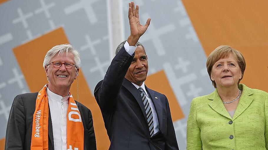 Kanzlerin Merkel und Ex-Präsident Obama mit EKD-Chef Bedford-Strohm in Berlin.