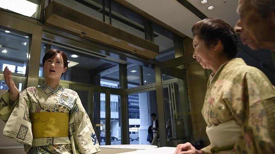 Toshiba's humanoid robot named Aiko Chihira at a reception desk