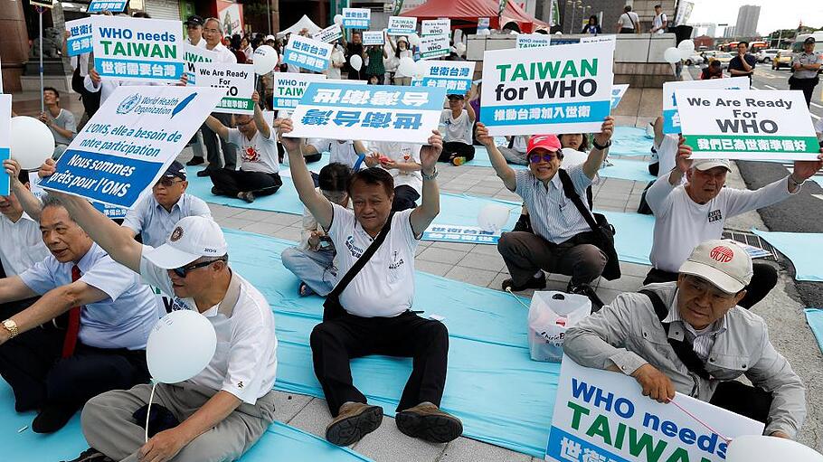 Protesters take part in a rally in Taipei against Taiwan being excluded from U.N.'s annual World Health Assembly in Geneva, Taiwan