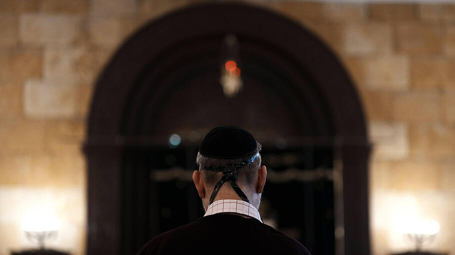A Jewish man prays at Chabad synagogue in downtown Odessa, Ukraine, 16 March 2022 (issued on 17 March 2022). Under the p
