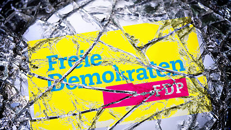 FDP-Logo in einem zerbrochenen Spiegel