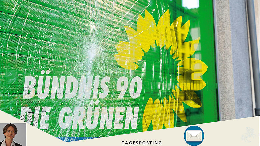 Eingeschlagene Scheibe mit Grünen-Logo