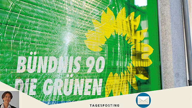 Eingeschlagene Scheibe mit Grünen-Logo