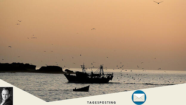 Sonnenuntergang über einem Fischerboot