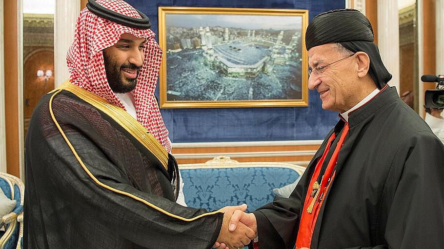 Saudi Crown Prince Mohammed bin Salman shakes hands with Lebanese Maronite Patriarch Bechara Boutros Al-Rahi during their meeting in Riyadh