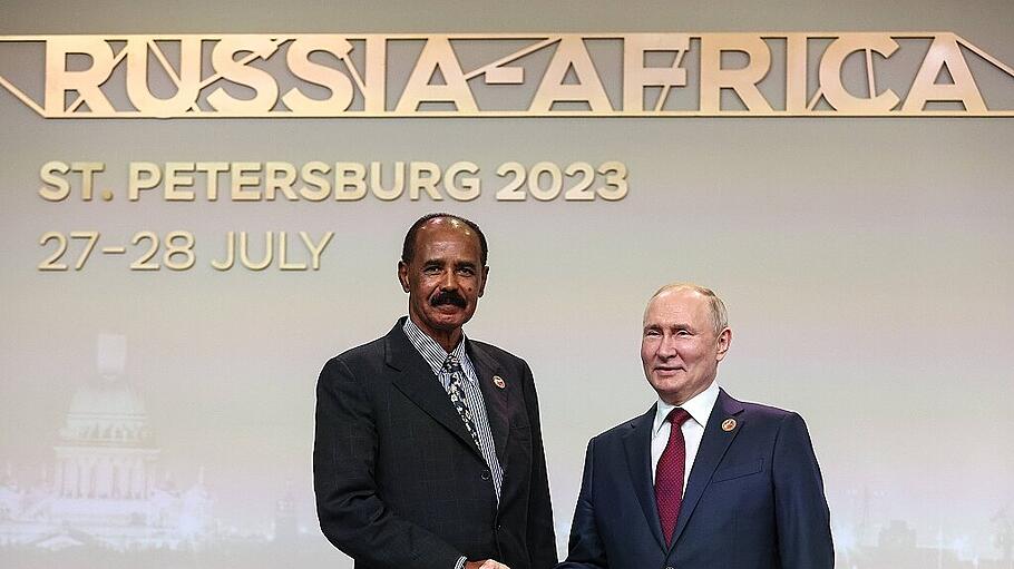 RUSSIA, ST PETERSBURG - JULY 27, 2023: Russia s President Vladimir Putin (R) shakes hands with President of the State of