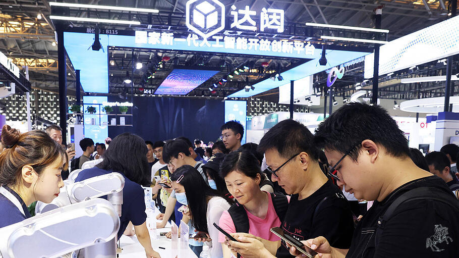 SHANGHAI, CHINA - JULY 06: People visit the booth of CloudMinds during 2023 World Artificial Intelligence Conference at