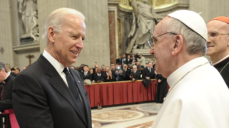 U.S. Vice President Joe Biden is greeted by Pope Francis in Saint Peter's Basilica after his inauguration at the Vatican
