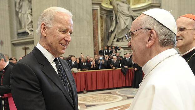 U.S. Vice President Joe Biden is greeted by Pope Francis in Saint Peter's Basilica after his inauguration at the Vatican